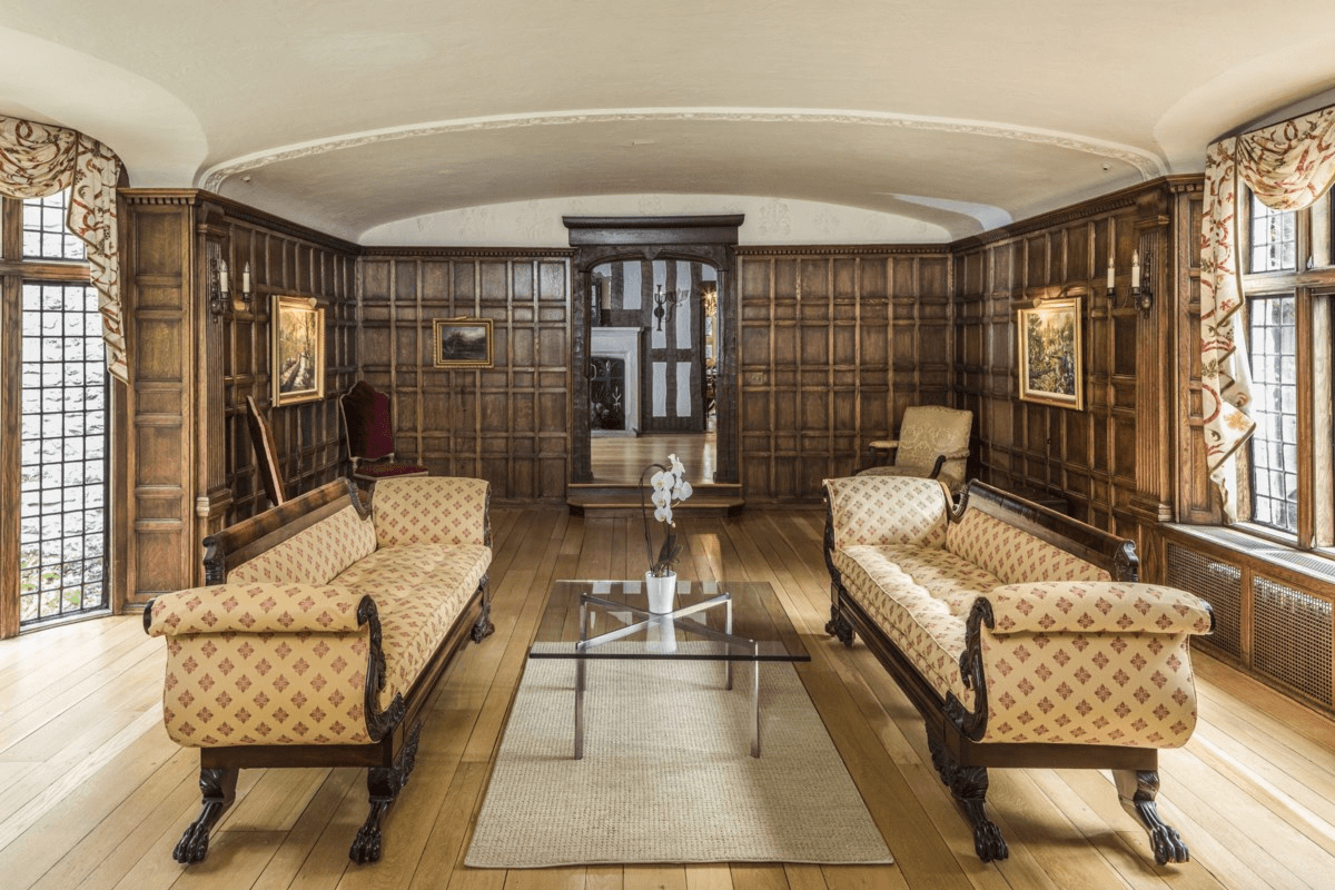 parlor with paneling and view into the entry hall