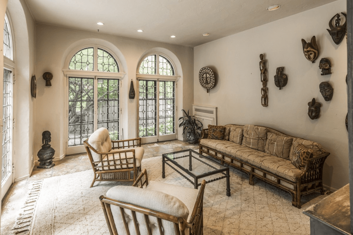 sun room with arched windows