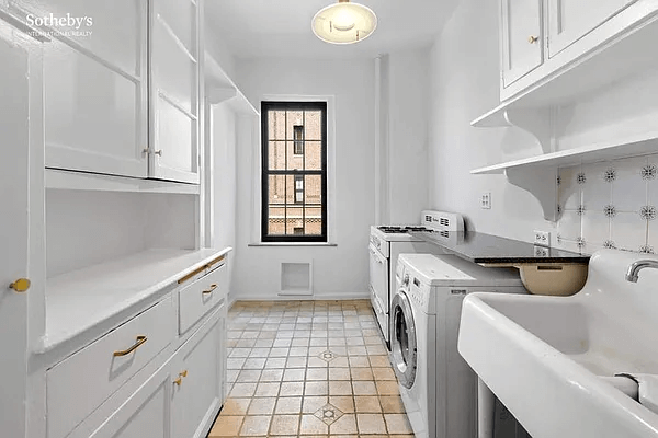 kitchen with washing machine and original cabinets and porcelain sink