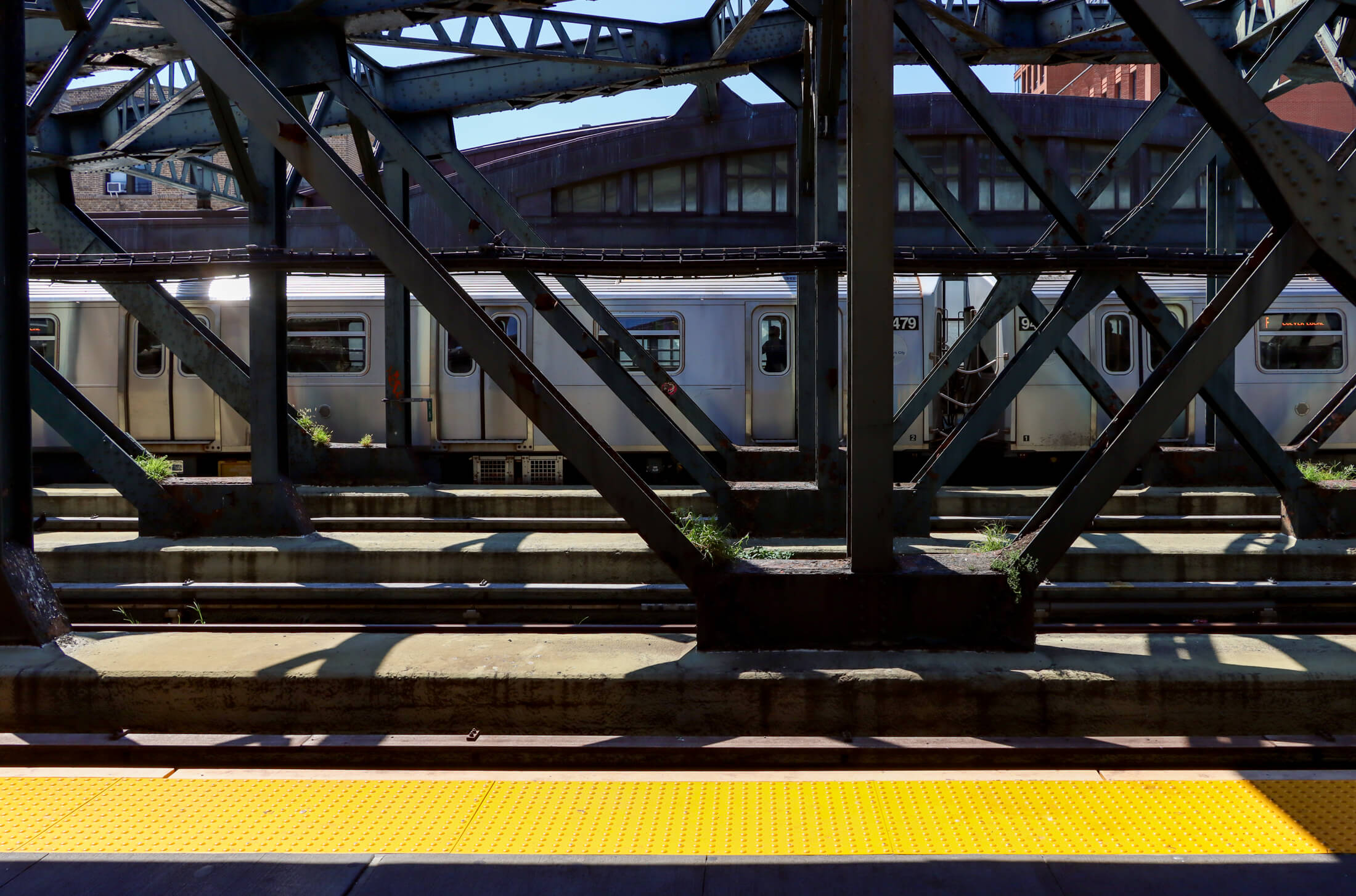 brooklyn - looking across train platform to an F train