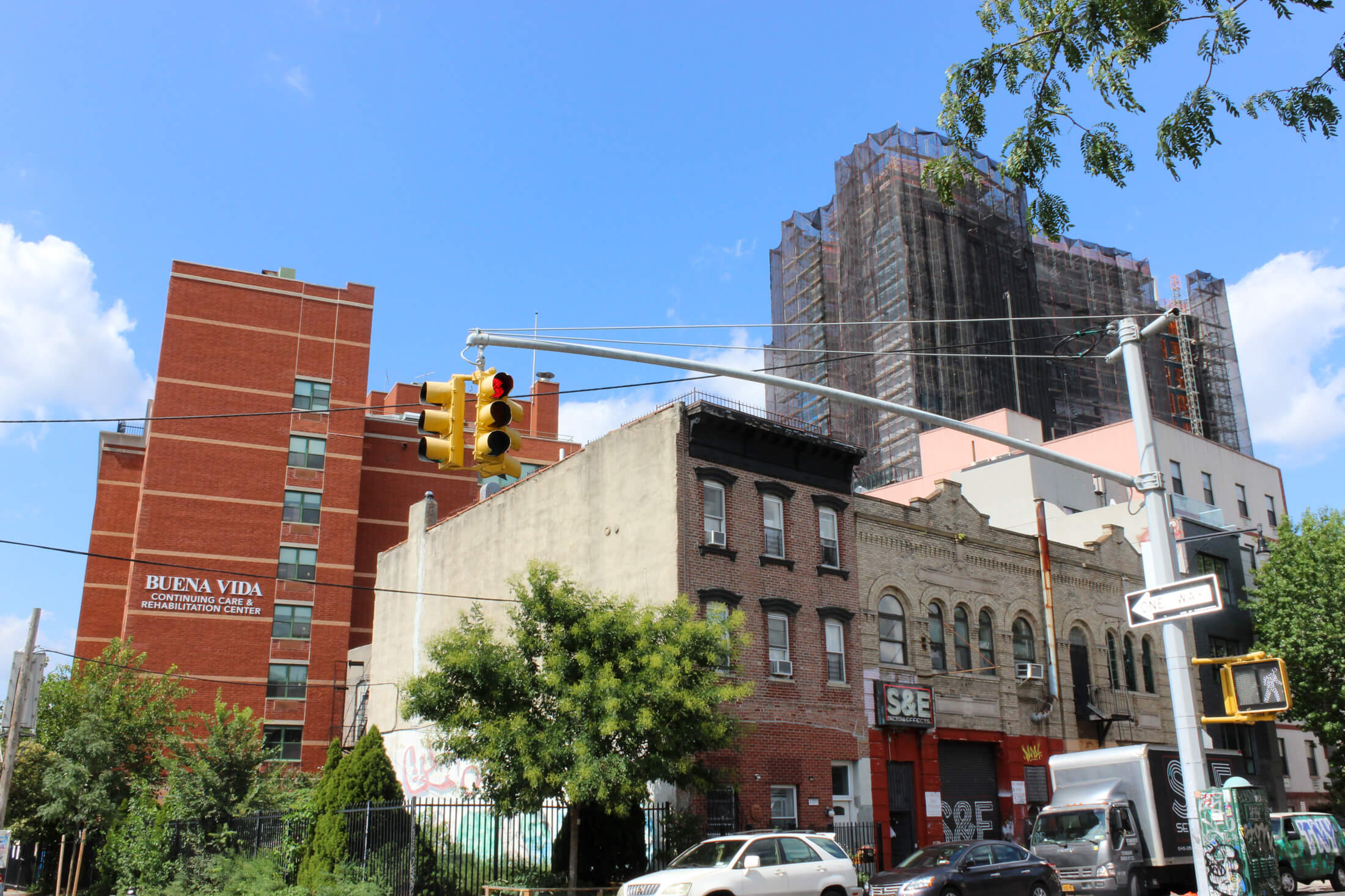 low scale buildings in front of the new construction