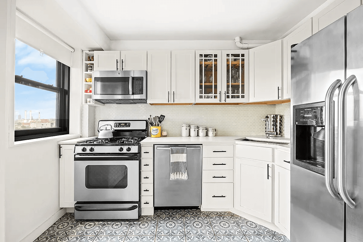 kitchen with white cabinets and graphic tile floor