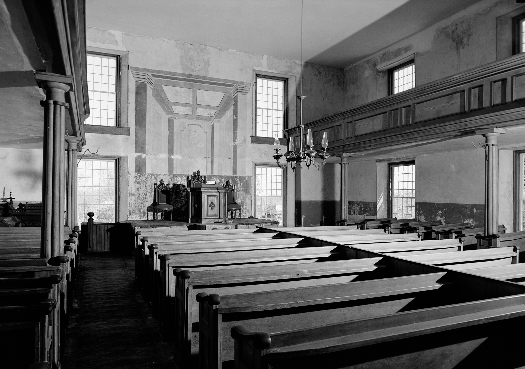black and white photo of a church interior