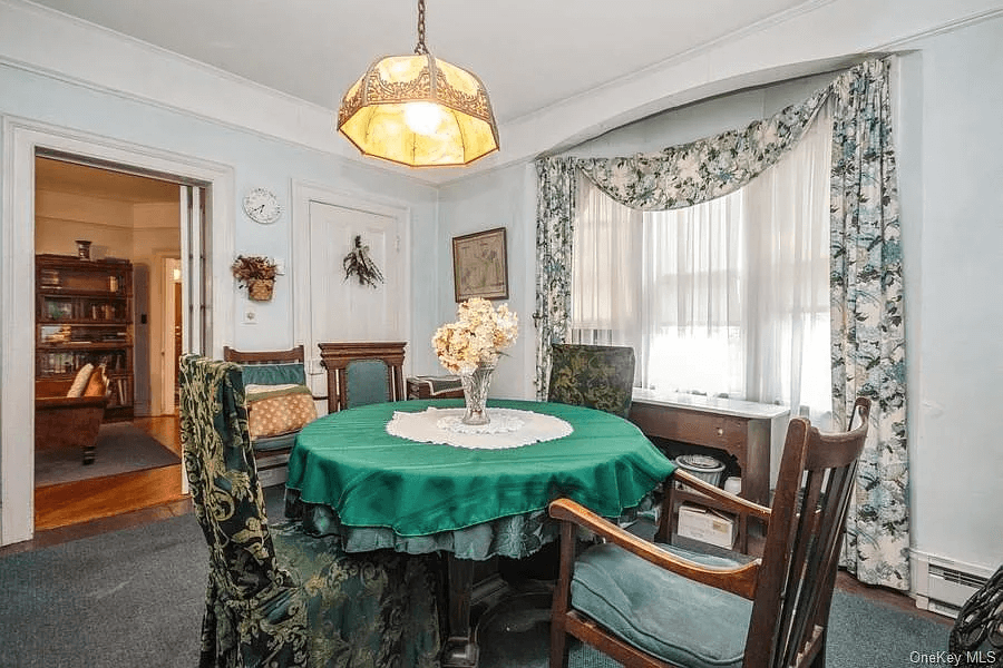 dining room with picture rails and view into parlor