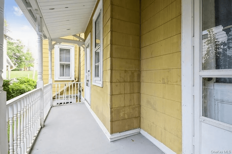view of rear porch with door from kitchen