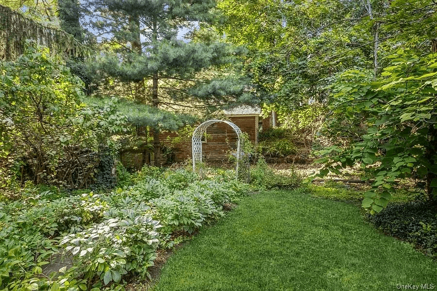garden with perennials and a trellis
