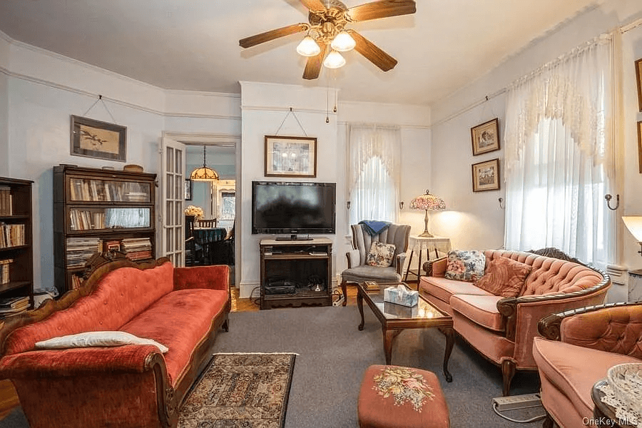 parlor with picture rail and glass door to dining room