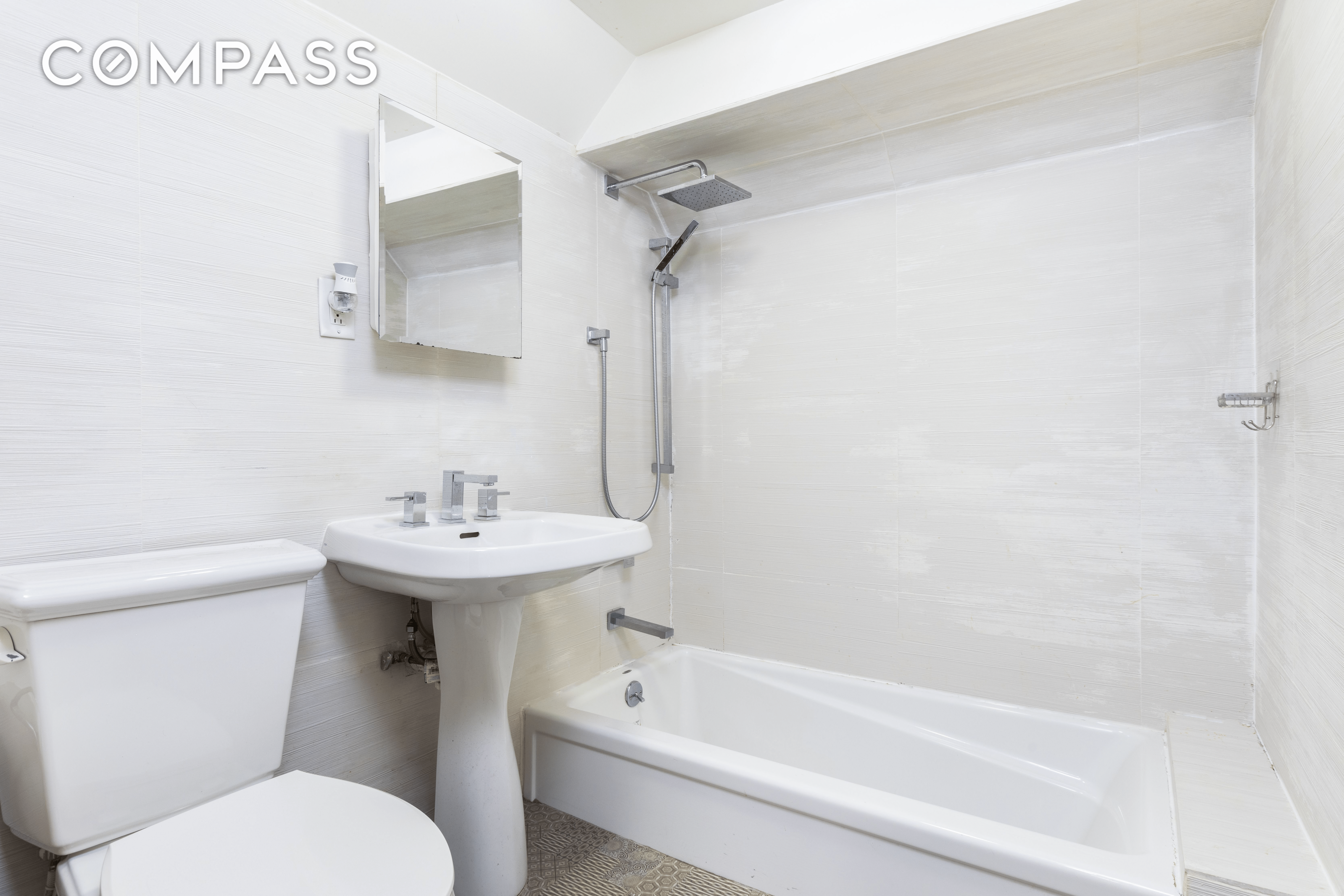 a bathroom with white fixtures