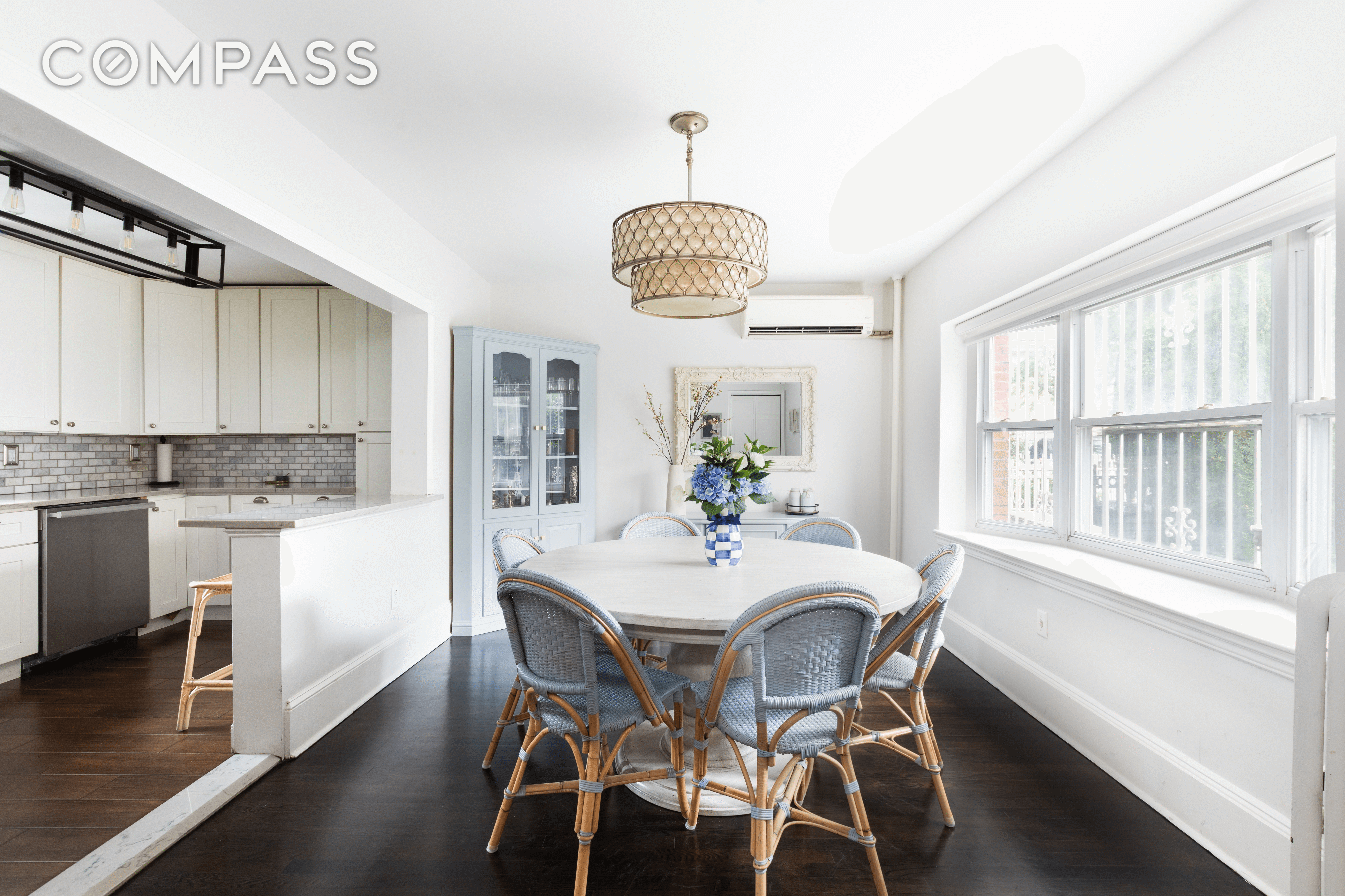 the dining area with a half wall between it and the kitchen