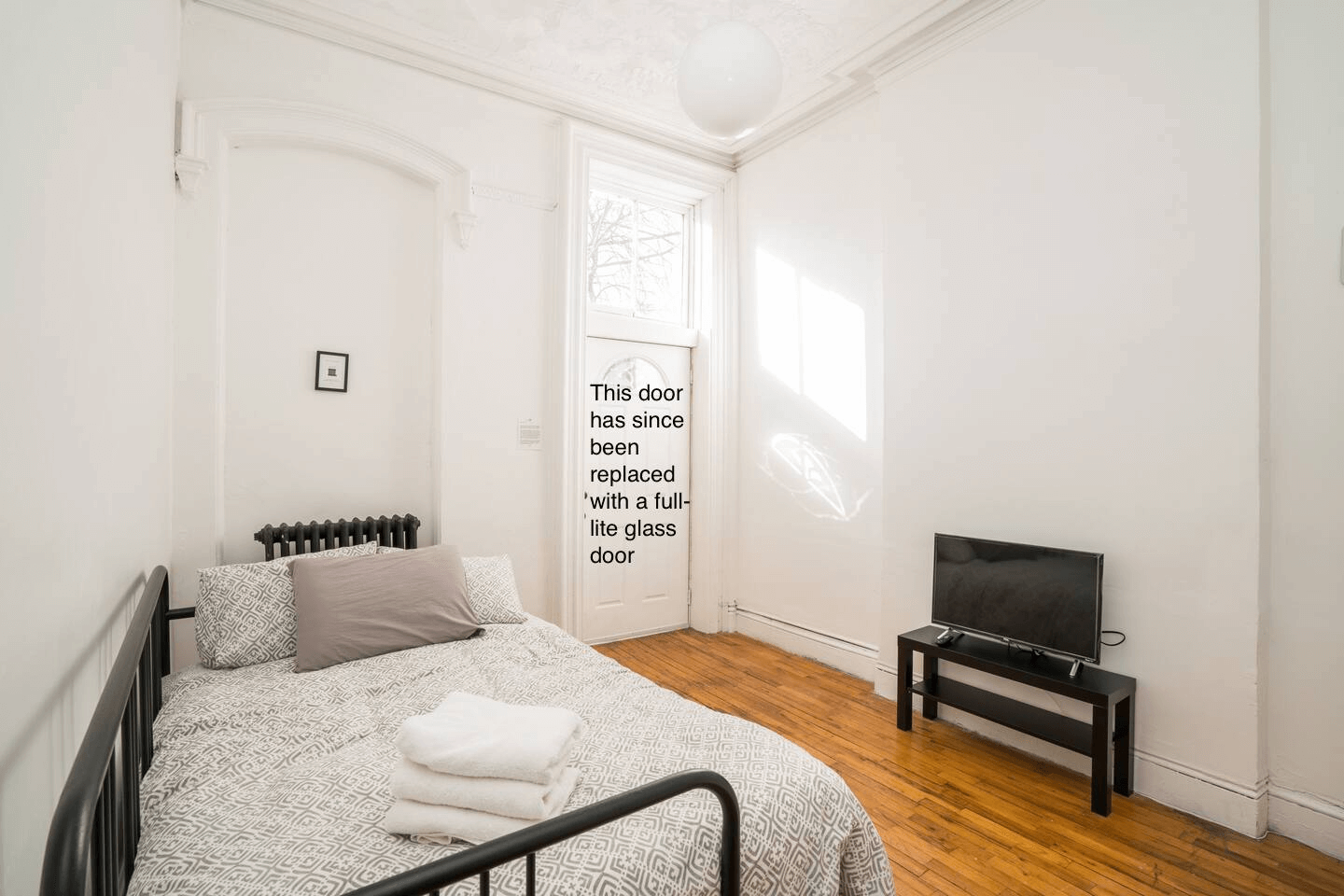 bedroom with a door to the rear yard