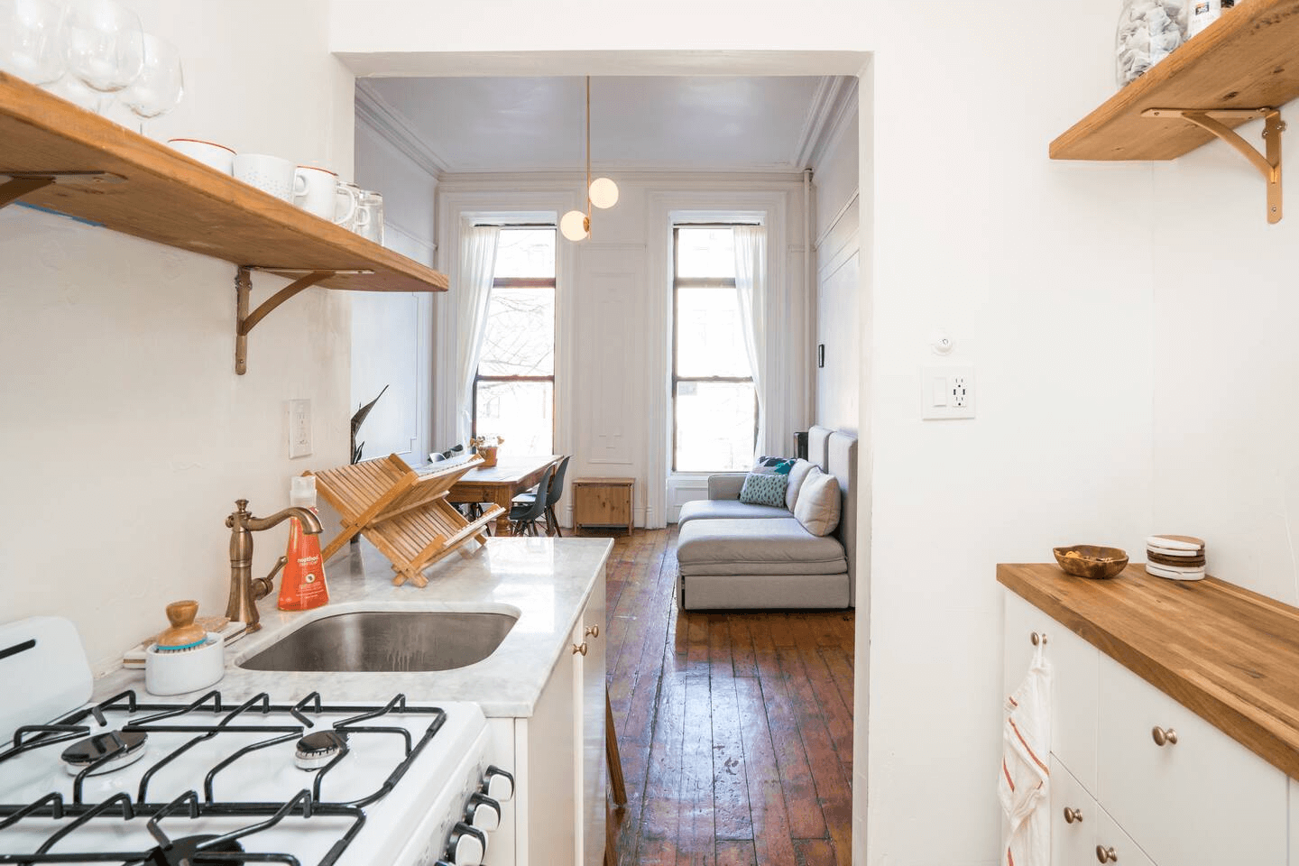 kitchen with open shelving and white cabinets