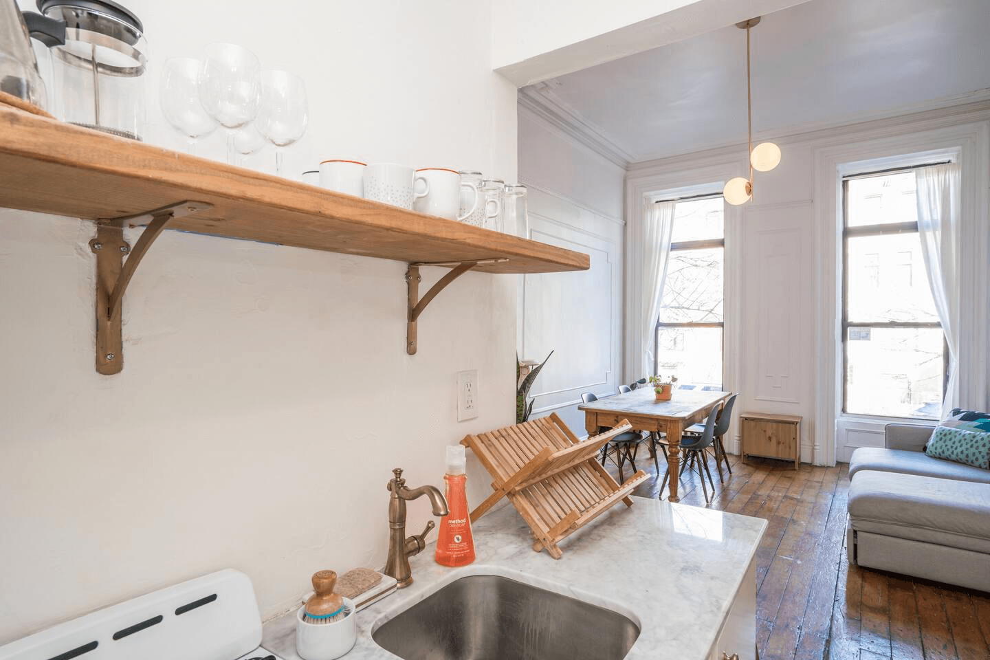 open wood shelf in kitchen with dishes