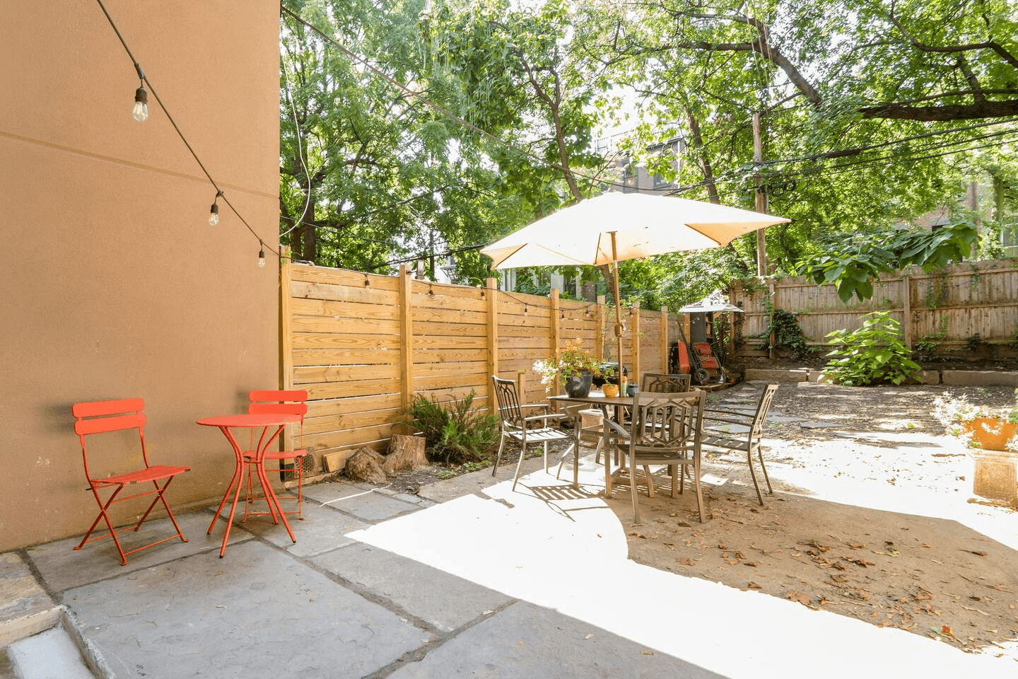 fenced-in rear yard with a patio