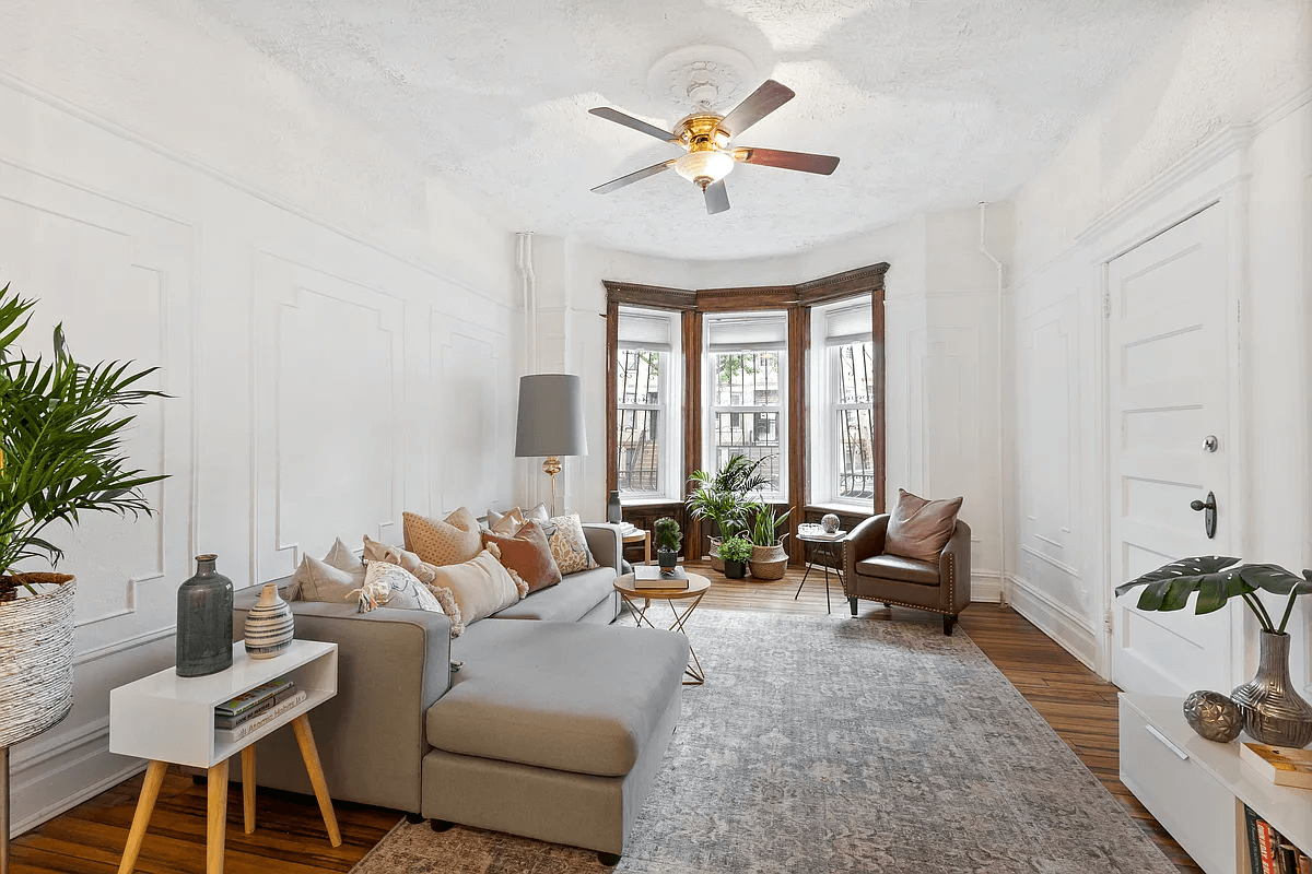 crown heights - living room with wall moldings, bay window, picture rails