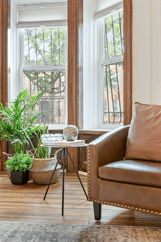 detail of bay window with unpainted moldings