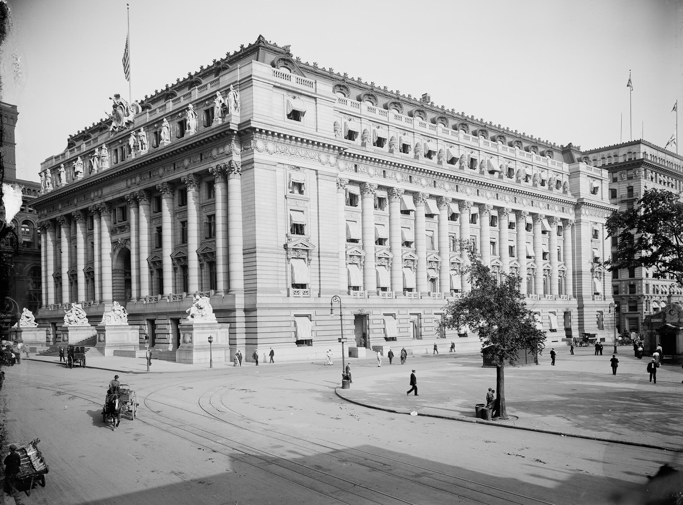 a black and white photo of the large customs house 