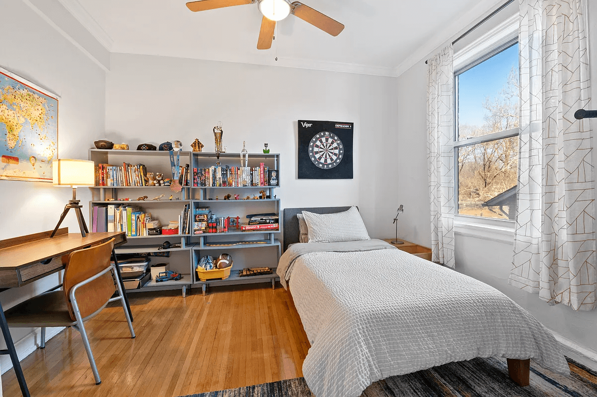 bedroom with wood floors and ceiling fan