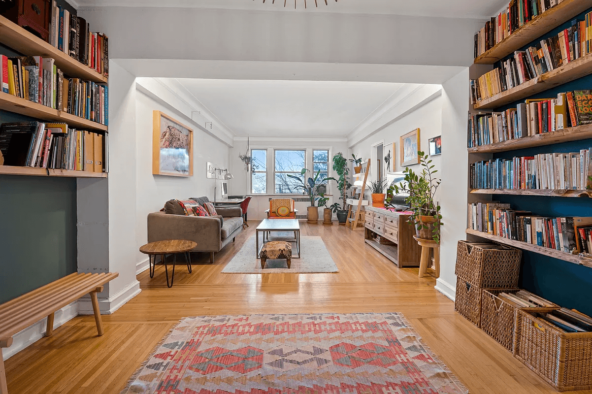 view of foyer with bookshelves to living room