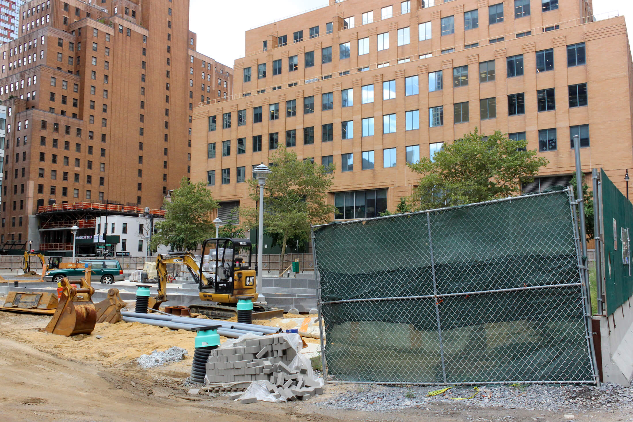 view from albee square towards willoughby showing piles of construction material