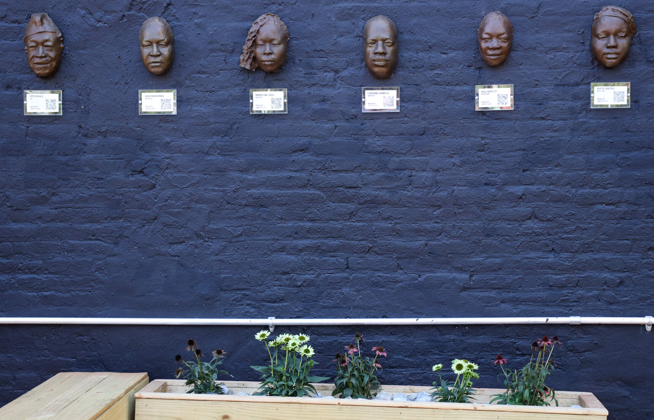 sculptures on a blue wall