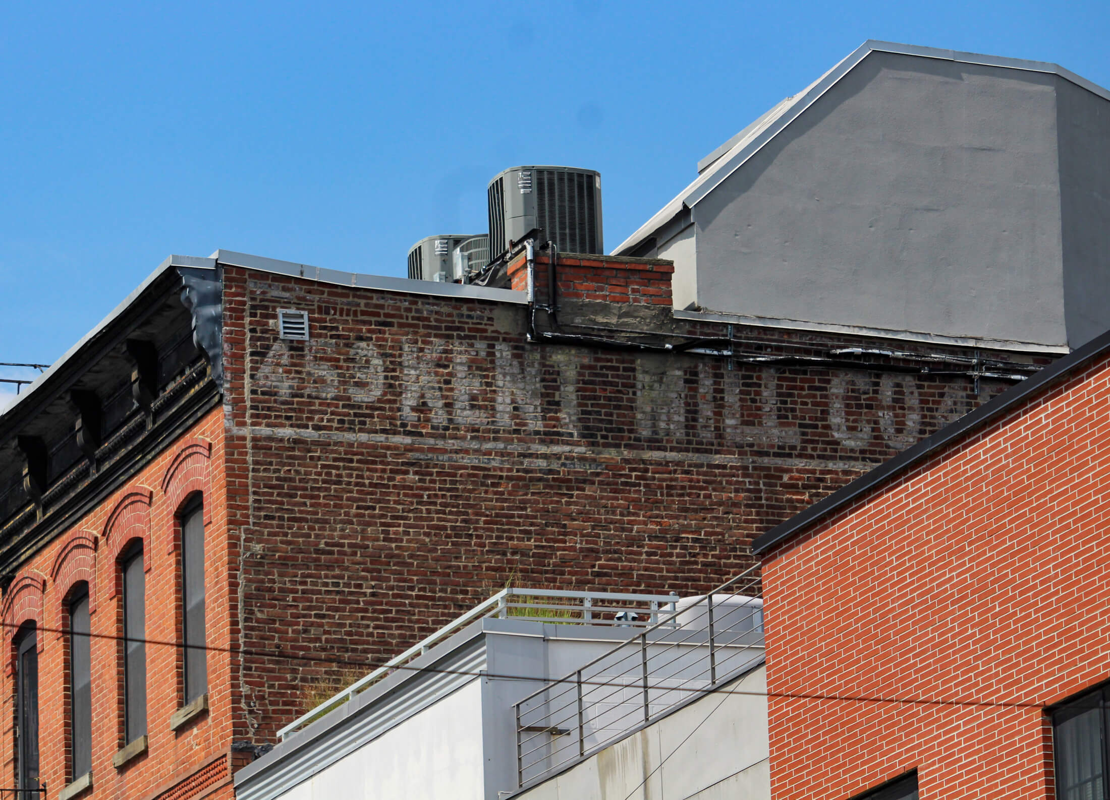 ghost sign for the kent mill co on the side of a building