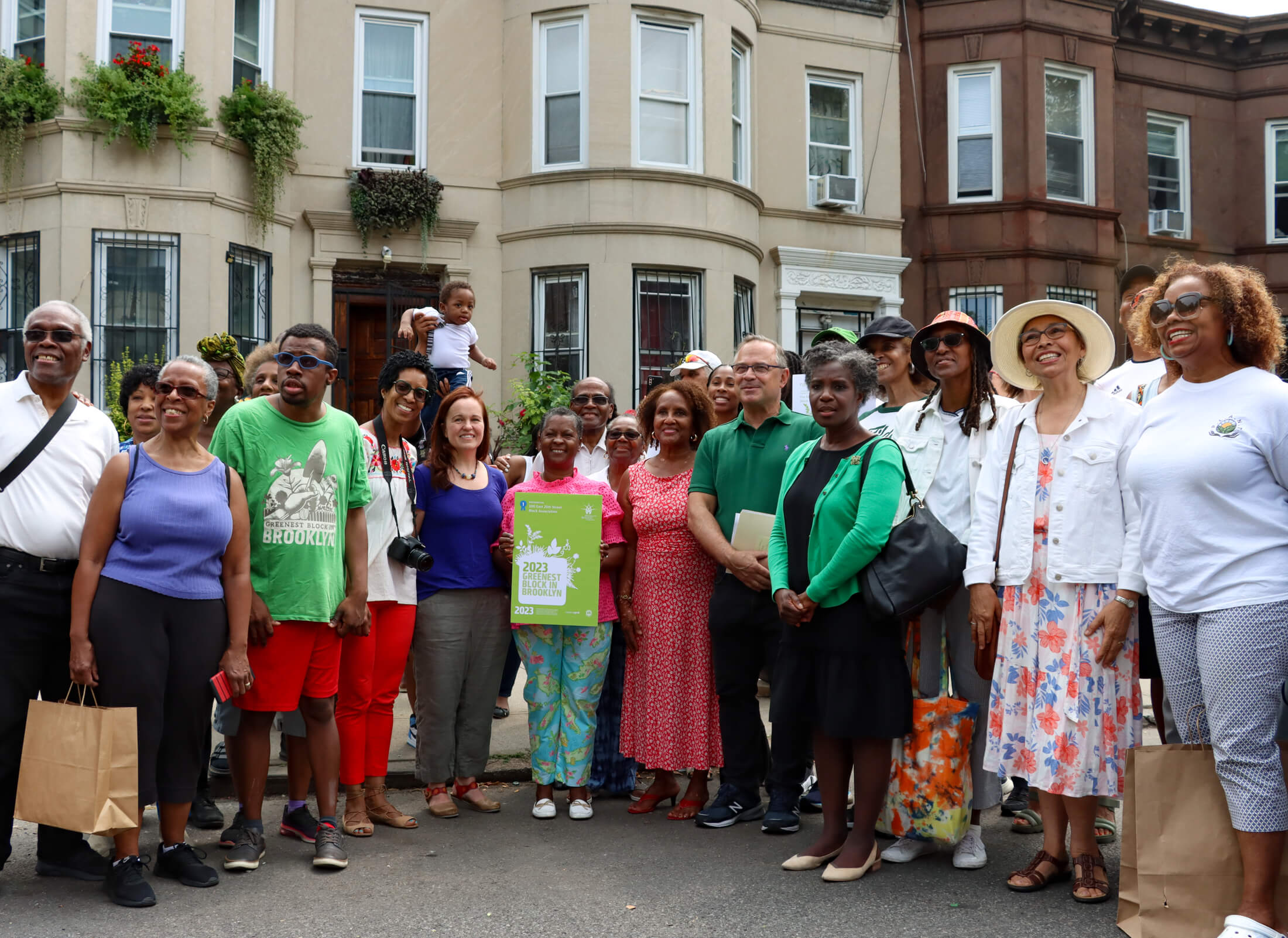 winners of the greenest block in brooklyn gathered on east 25th street