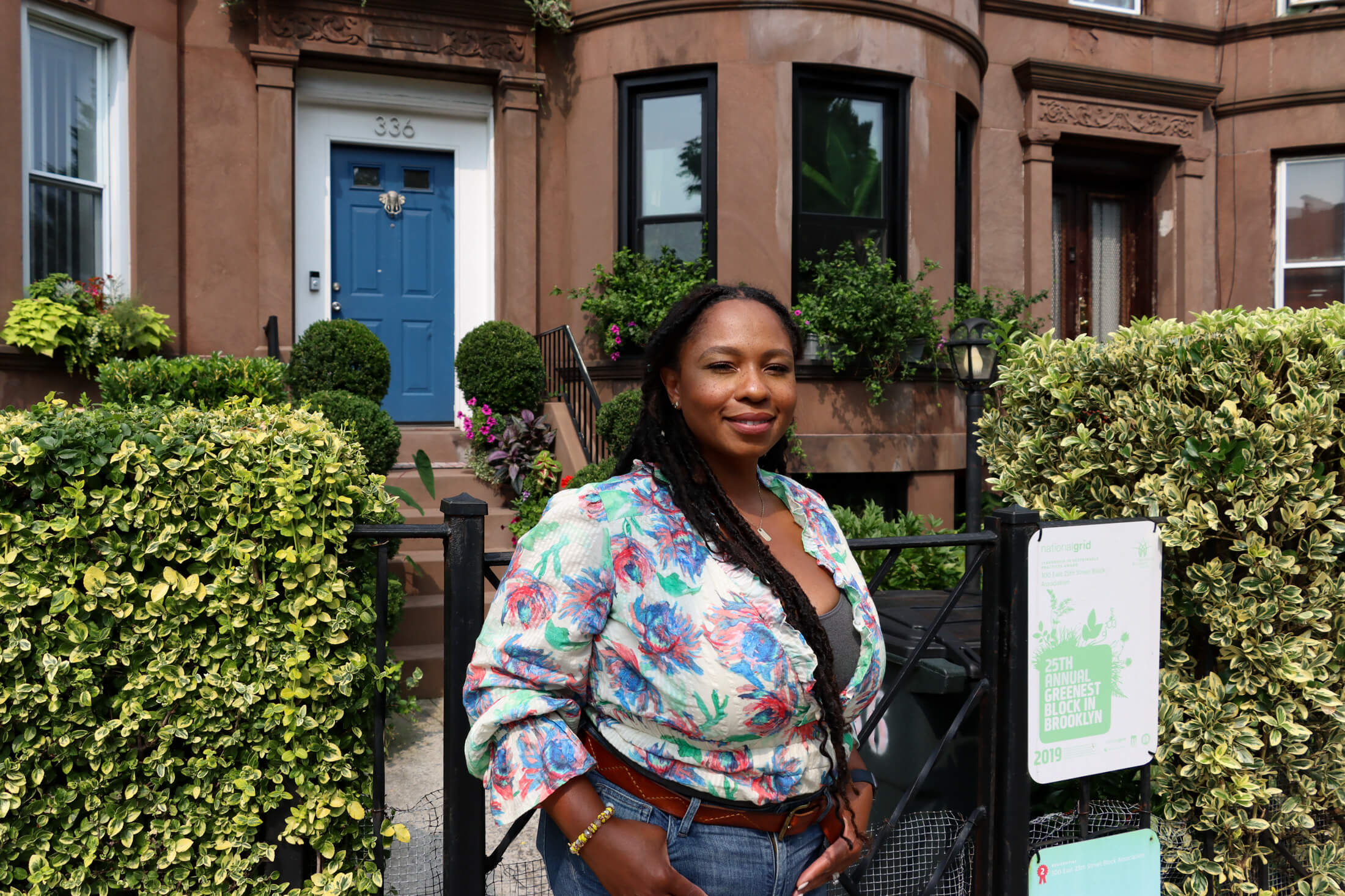 julia charles standing in front of brownstones on the block