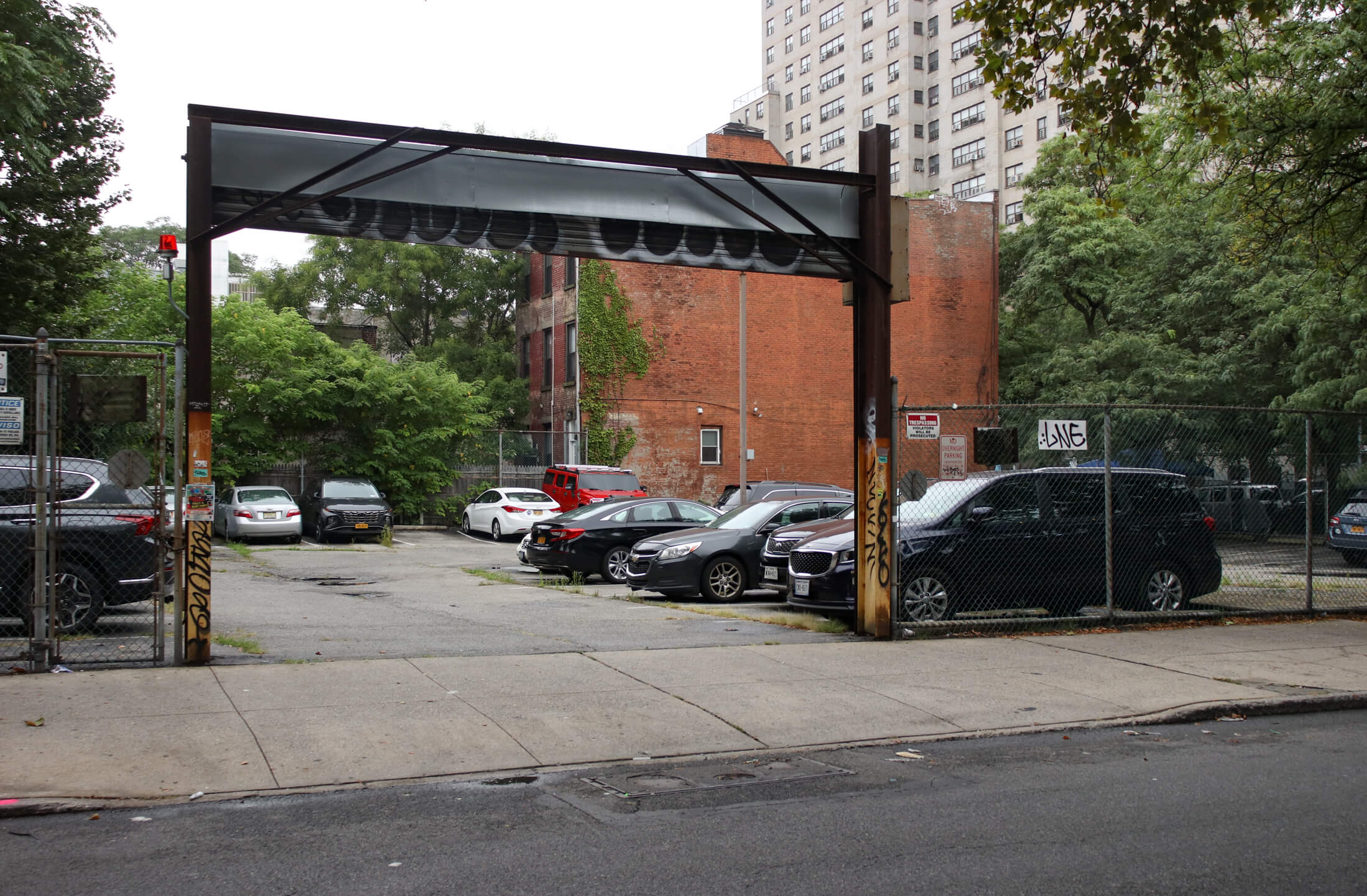 parking lot at 153 nevins street next to row houses