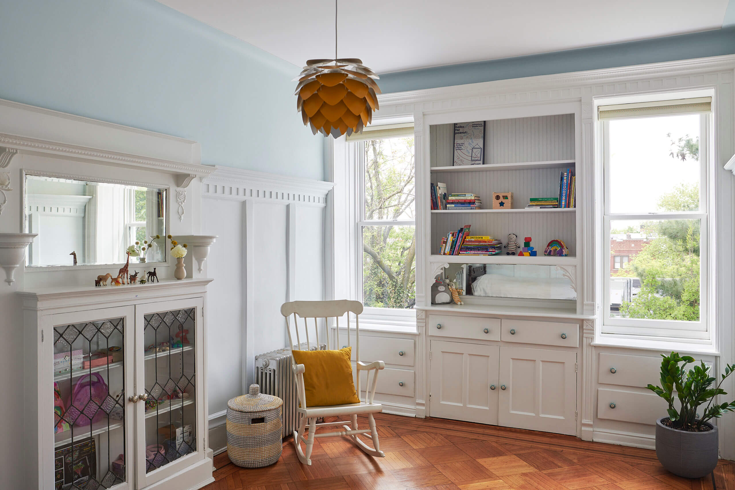 BEDROOM with white painted wainscoting and built-ins