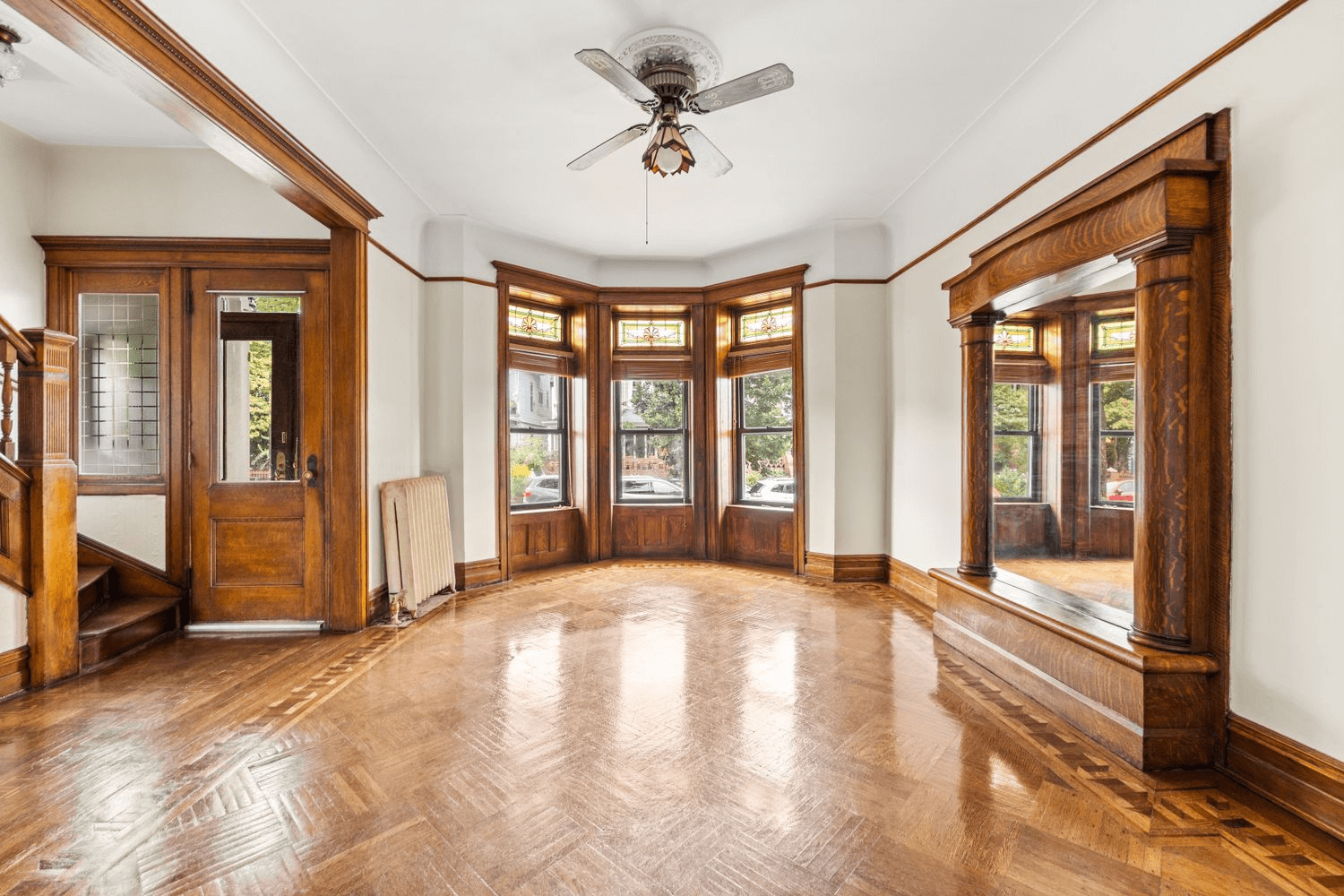kensington parlor with pier mirror and wood floors and trim