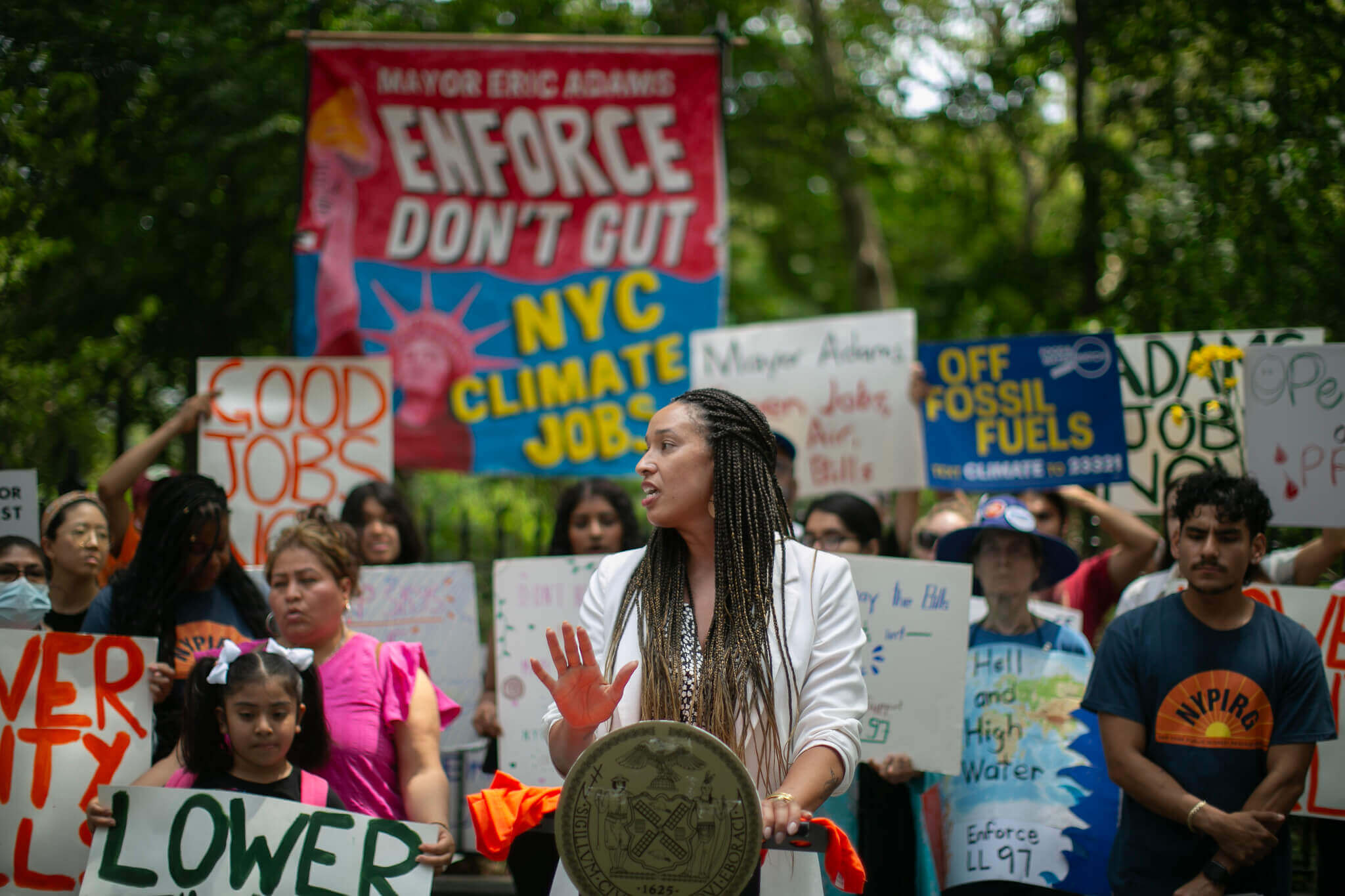 people holding signs at the rally