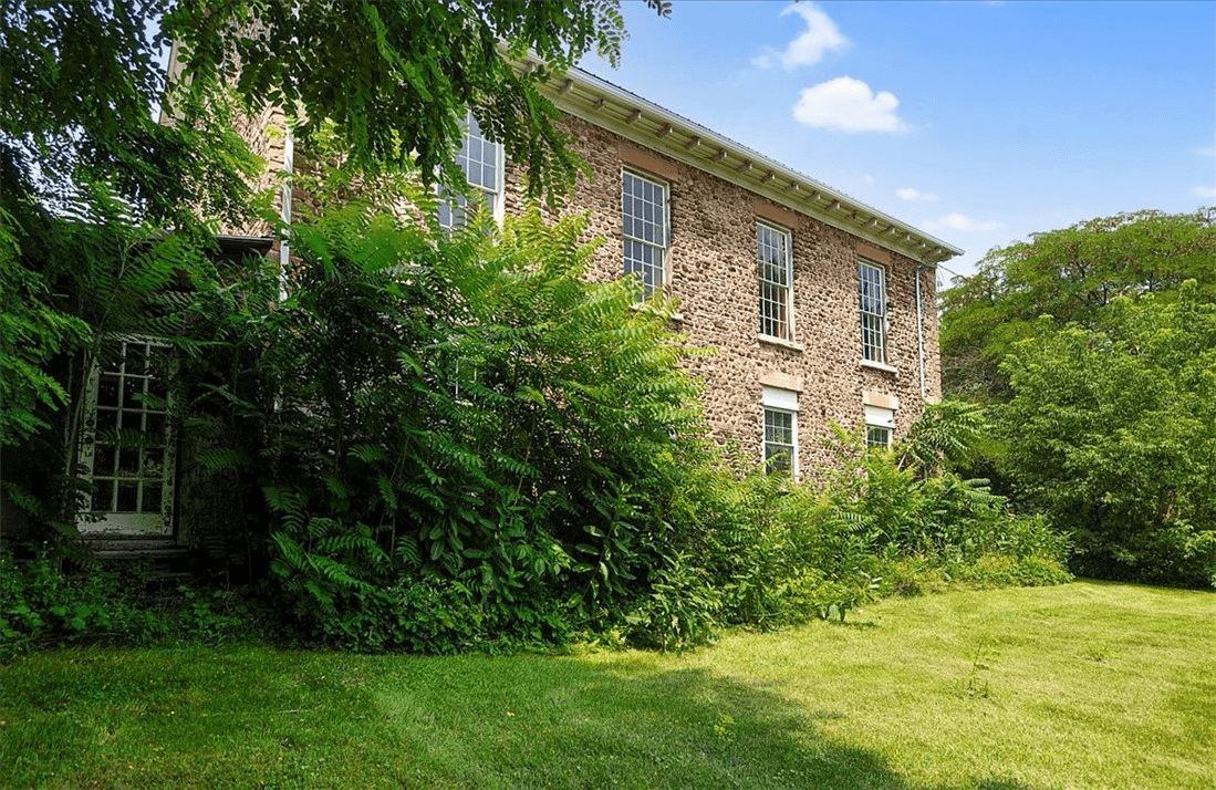 side facade with glimpse of rear addition