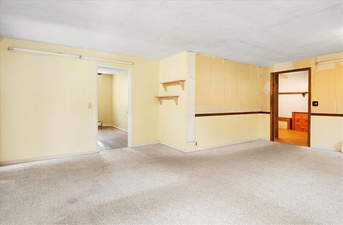 room with carpet and baseboard heat