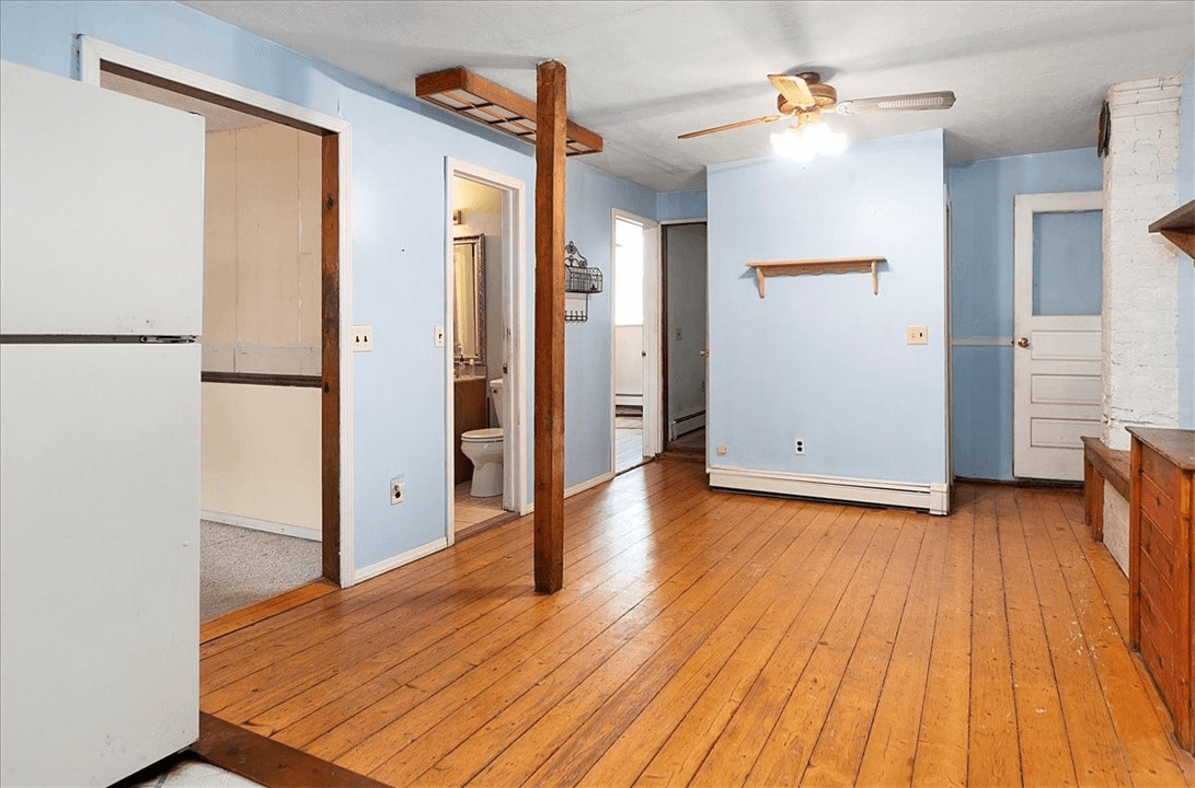 view from kitchen to dining area and view into a bathroom