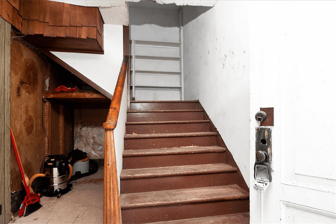 interior stair with original simple wood newel post
