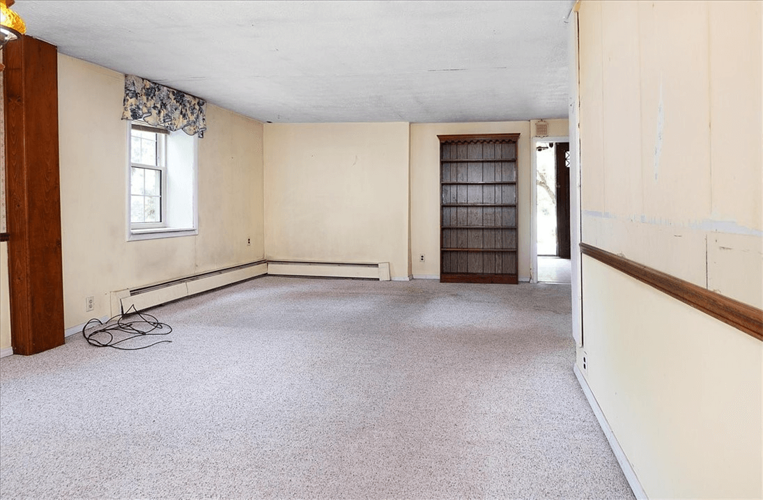 room with carpet and baseboard heat