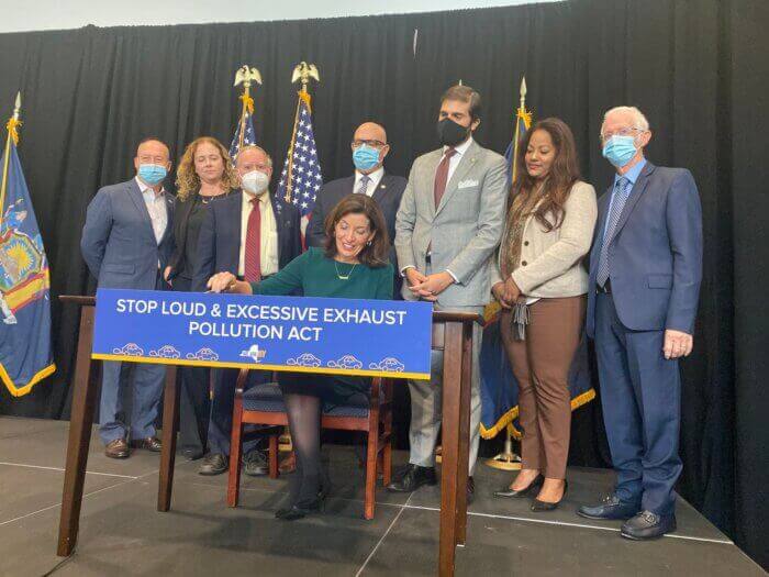group standing behind gov hochul during signing ceremony