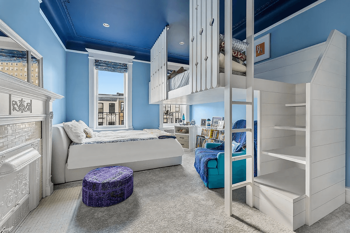 childrens bedroom with loft bed and blue walls