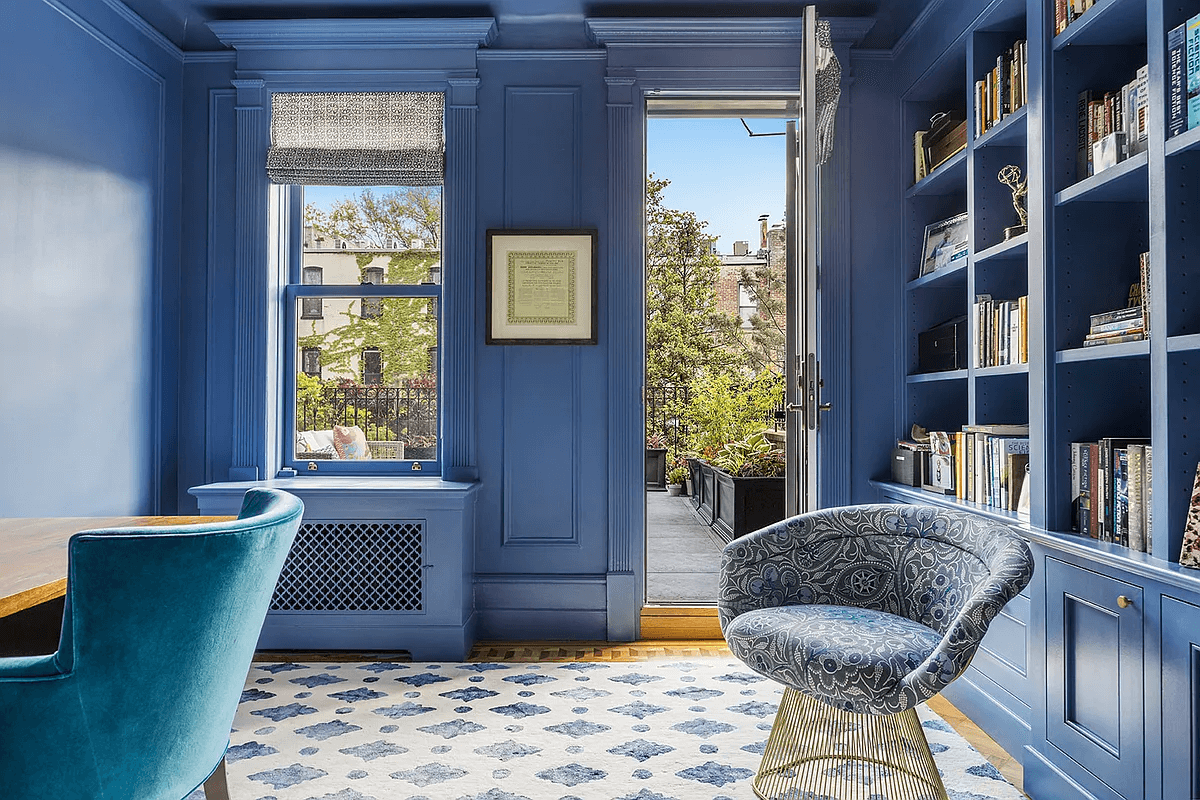 library with built-in shelves with door to terrace