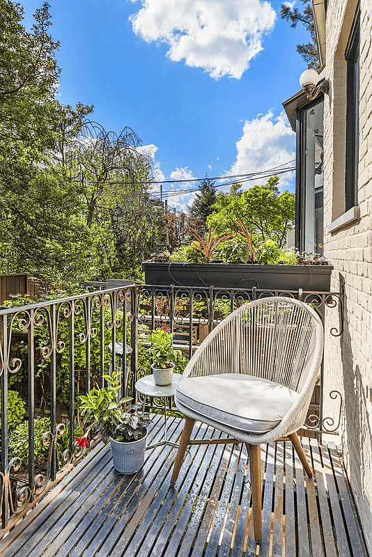 small balcony off the kitchen with room for a chair