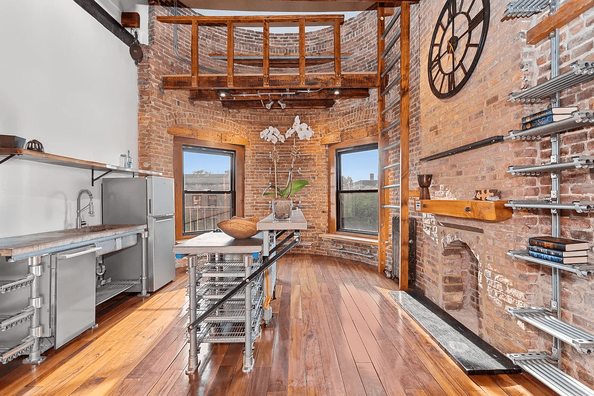 kitchen with exposed brick and lofted area