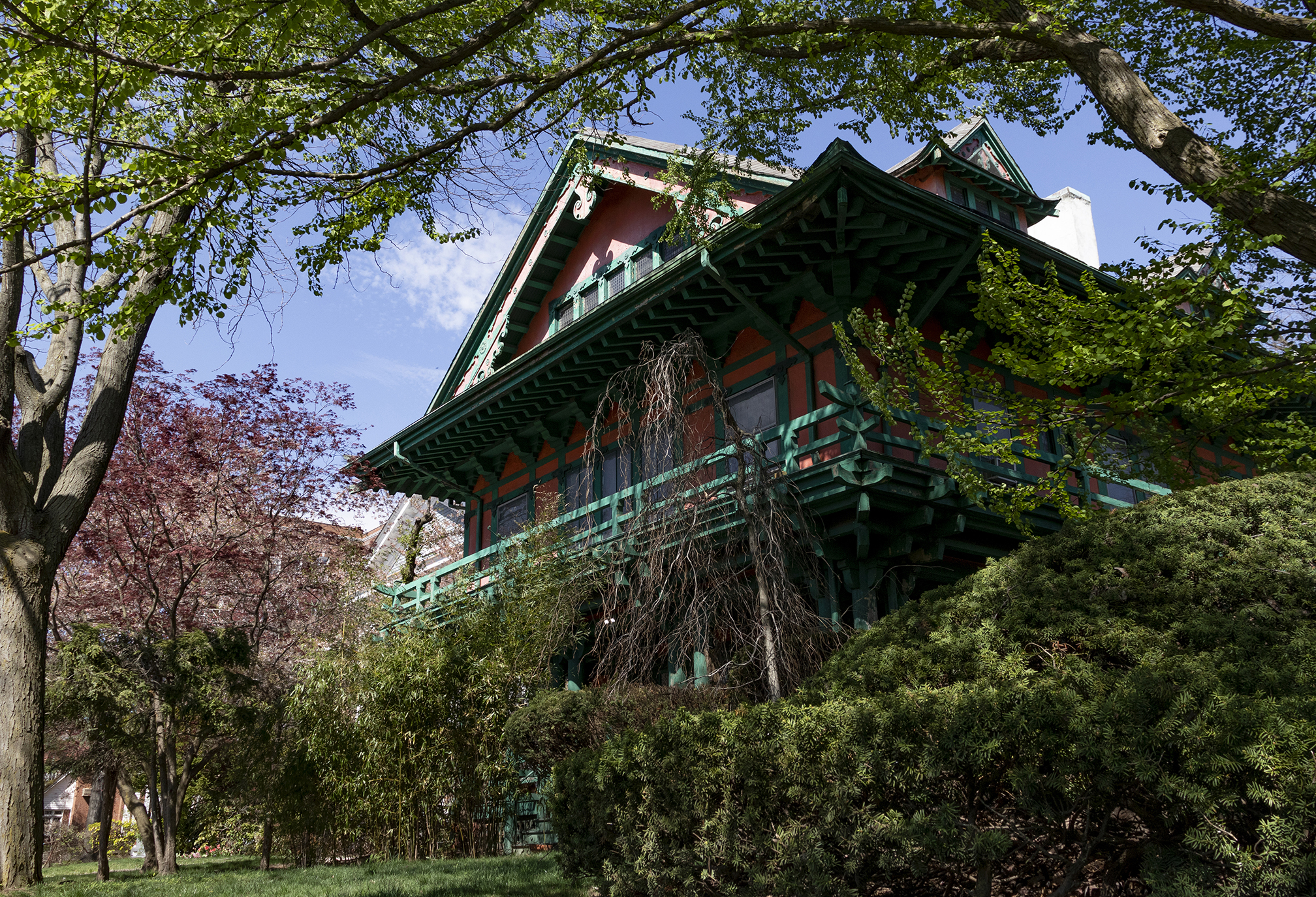 prospect park south - wood and stucco house framed by spring trees