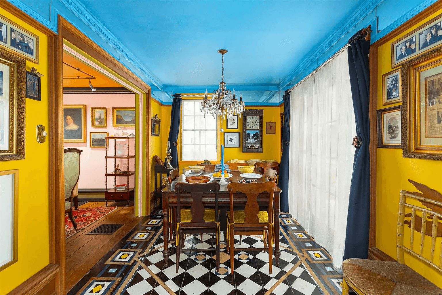 greek revival house -dining room with yellow walls, blue ceiling and painted floor