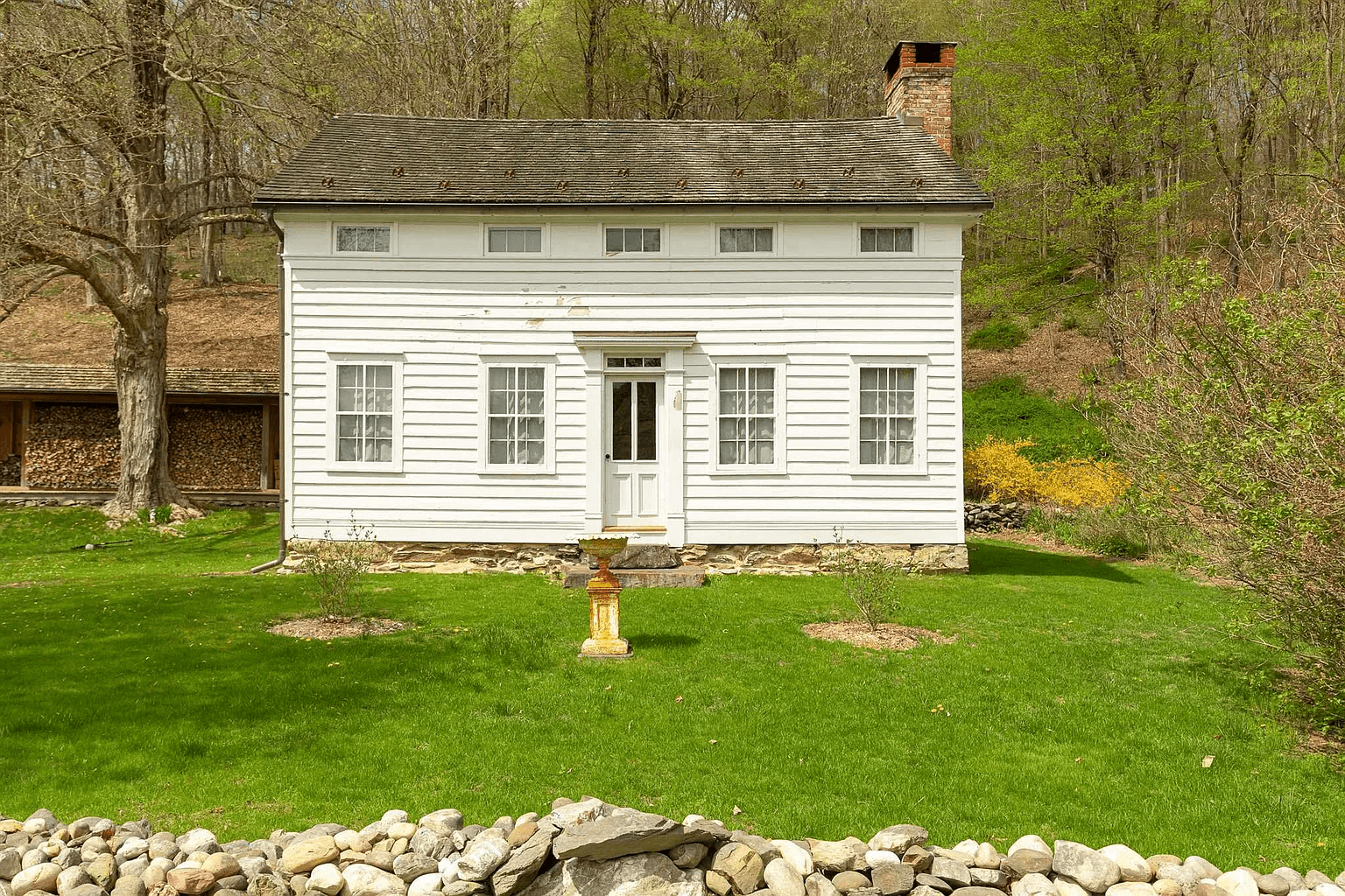 main facade of white greek revival house