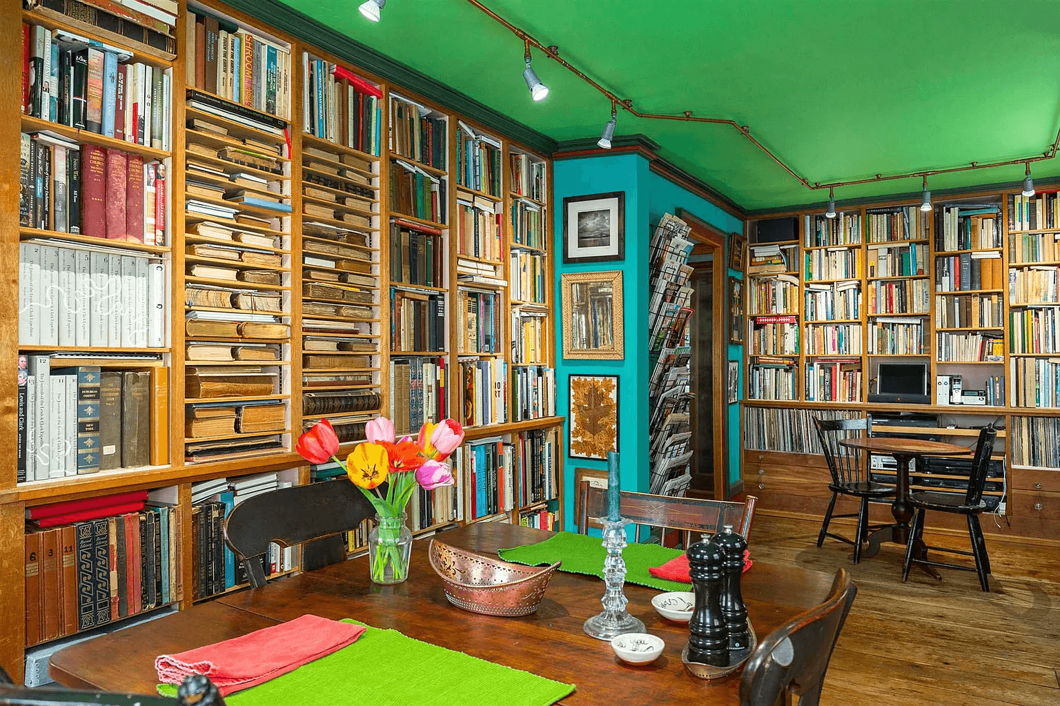 library with walls of shelves and a green ceiling