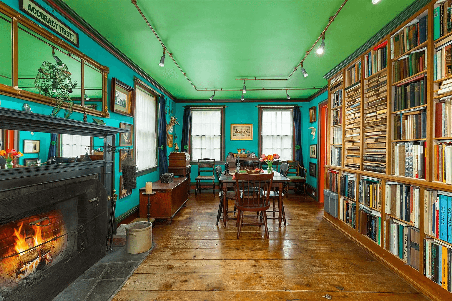 library with fireplace and walls of bookshelves