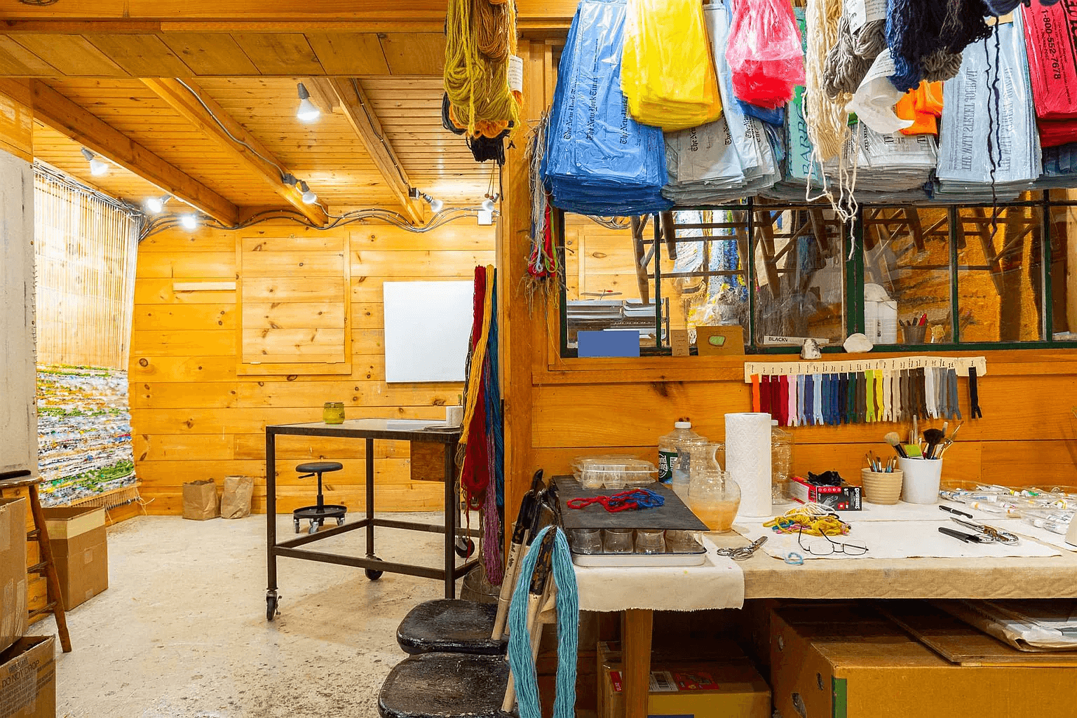 view of studio with wood walls and ceilings