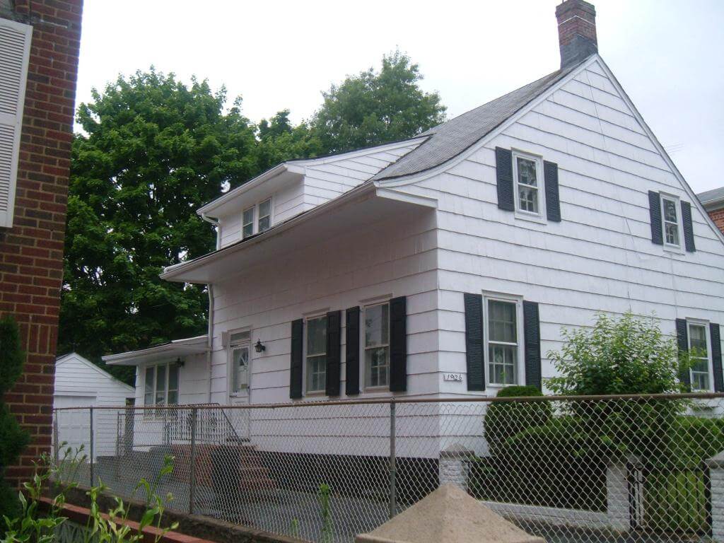 wood frame house looking cared for and lawn trimmed