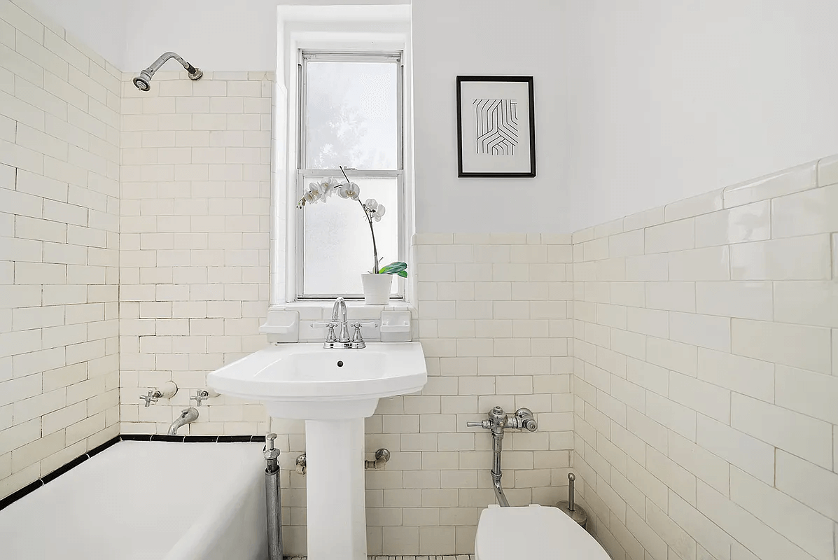 bathroom with vintage white subway tiles