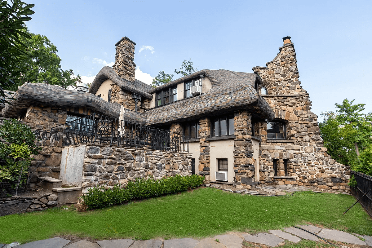 view of house from the rear with a patio and a bit of lawn